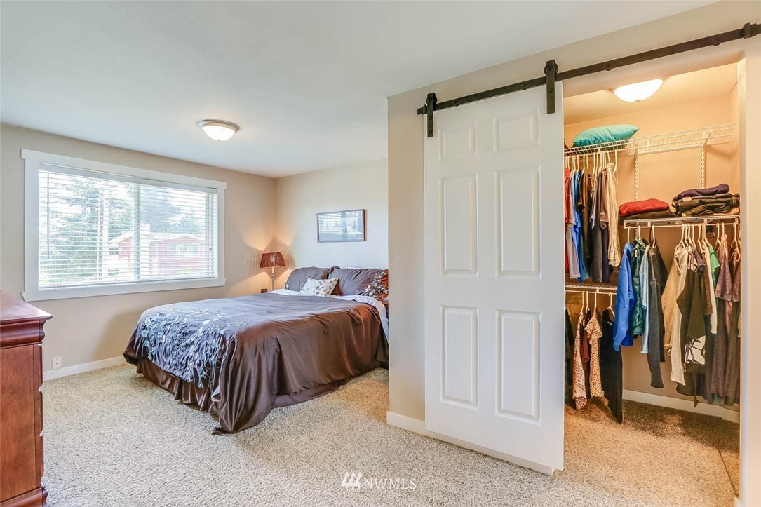 3522 Northeast 10th Place Renton, WA 98056 - Photo 16 of 34 a bed room with a bed and a window