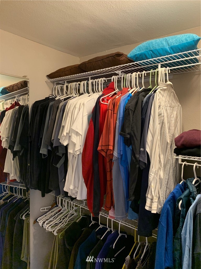 3522 Northeast 10th Place Renton, WA 98056 - Photo 17 of 34 a view of walk in closet with clothes and shoes