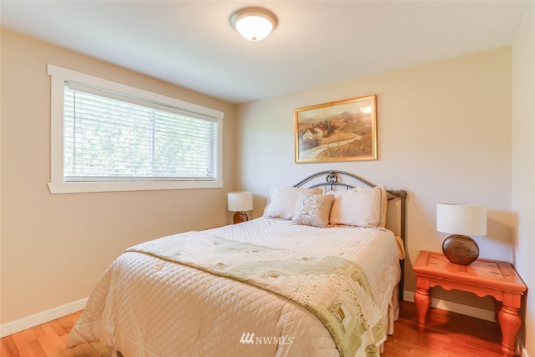 3522 Northeast 10th Place Renton, WA 98056 - Photo 22 of 34 a bedroom with a bed and a window