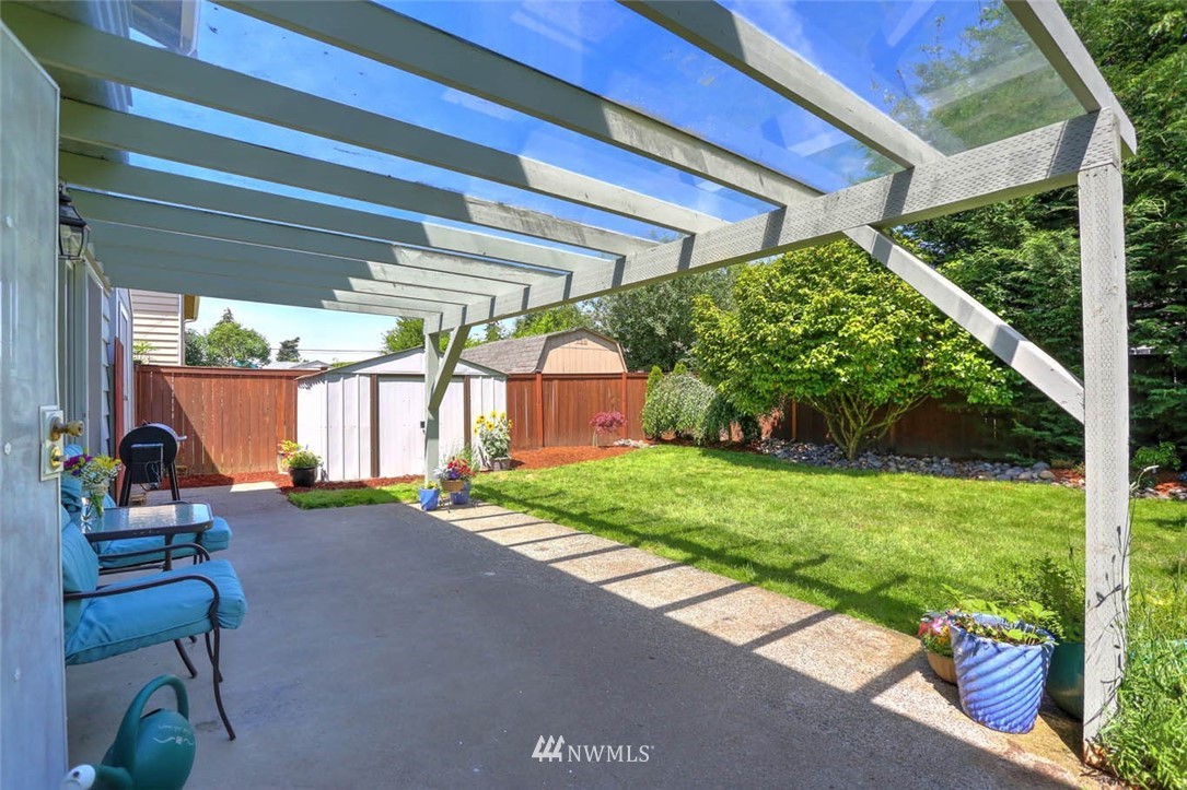 3522 Northeast 10th Place Renton, WA 98056 - Photo 27 of 34 a backyard of a house with a garden and outdoor seating