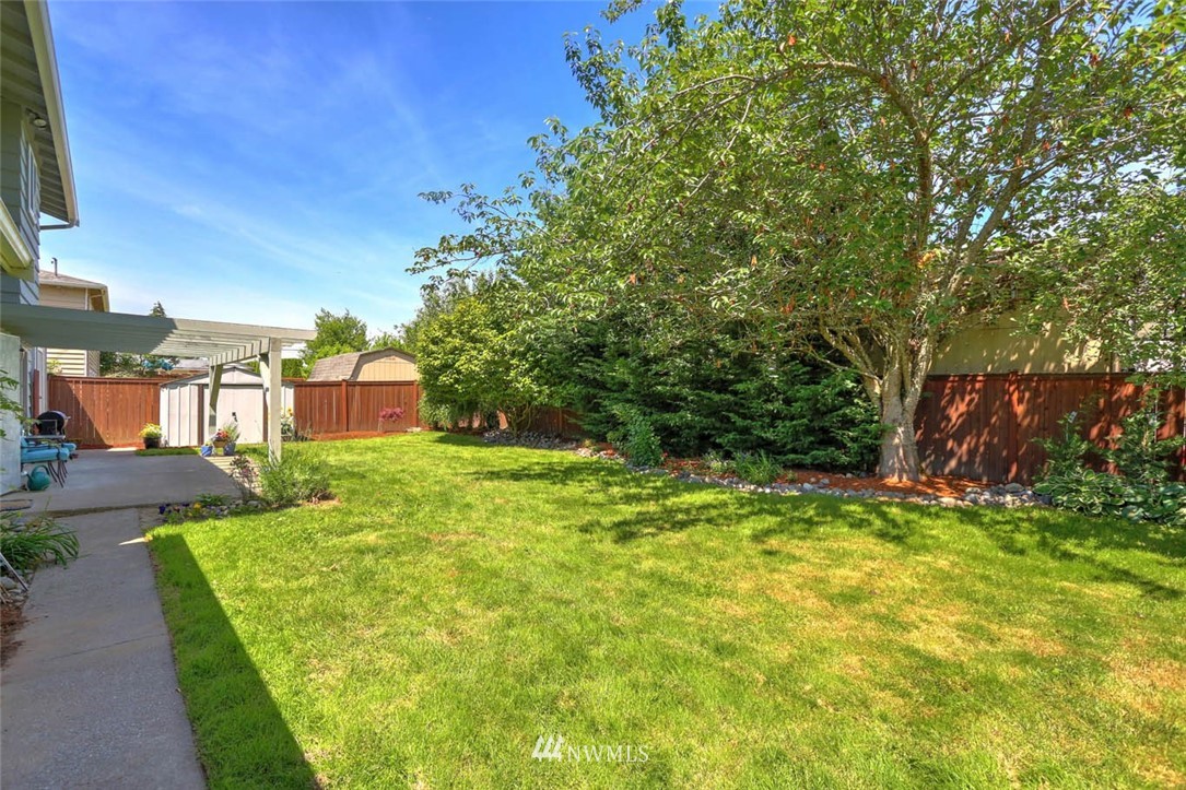 3522 Northeast 10th Place Renton, WA 98056 - Photo 28 of 34 a view of a backyard with plants and a patio