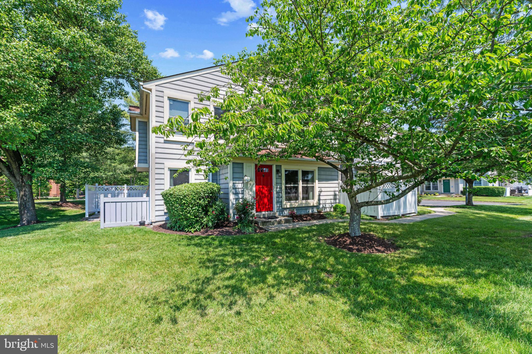 9302 Player Drive, Unit 155 Laurel, MD 20708 - Photo 1 of 43 a view of a house with a yard and tree s