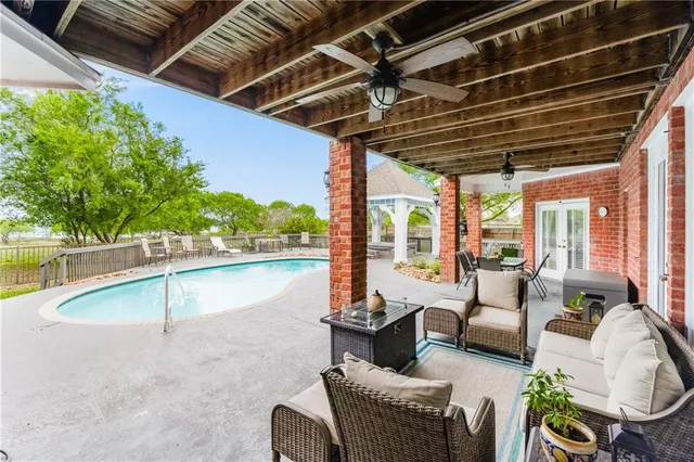 a kitchen with stainless steel appliances granite countertop a stove and a white cabinets