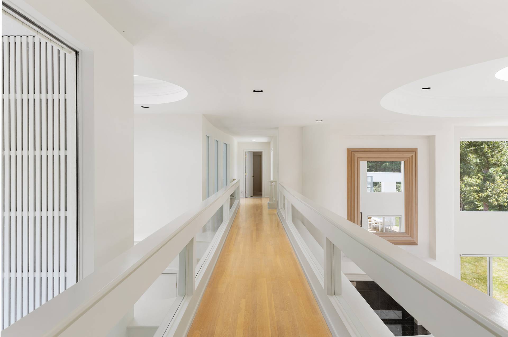 147 Old Northwest Road East Hampton, NY 11937 - Photo 15 of 33 a view of a hallway with wooden floor and staircase