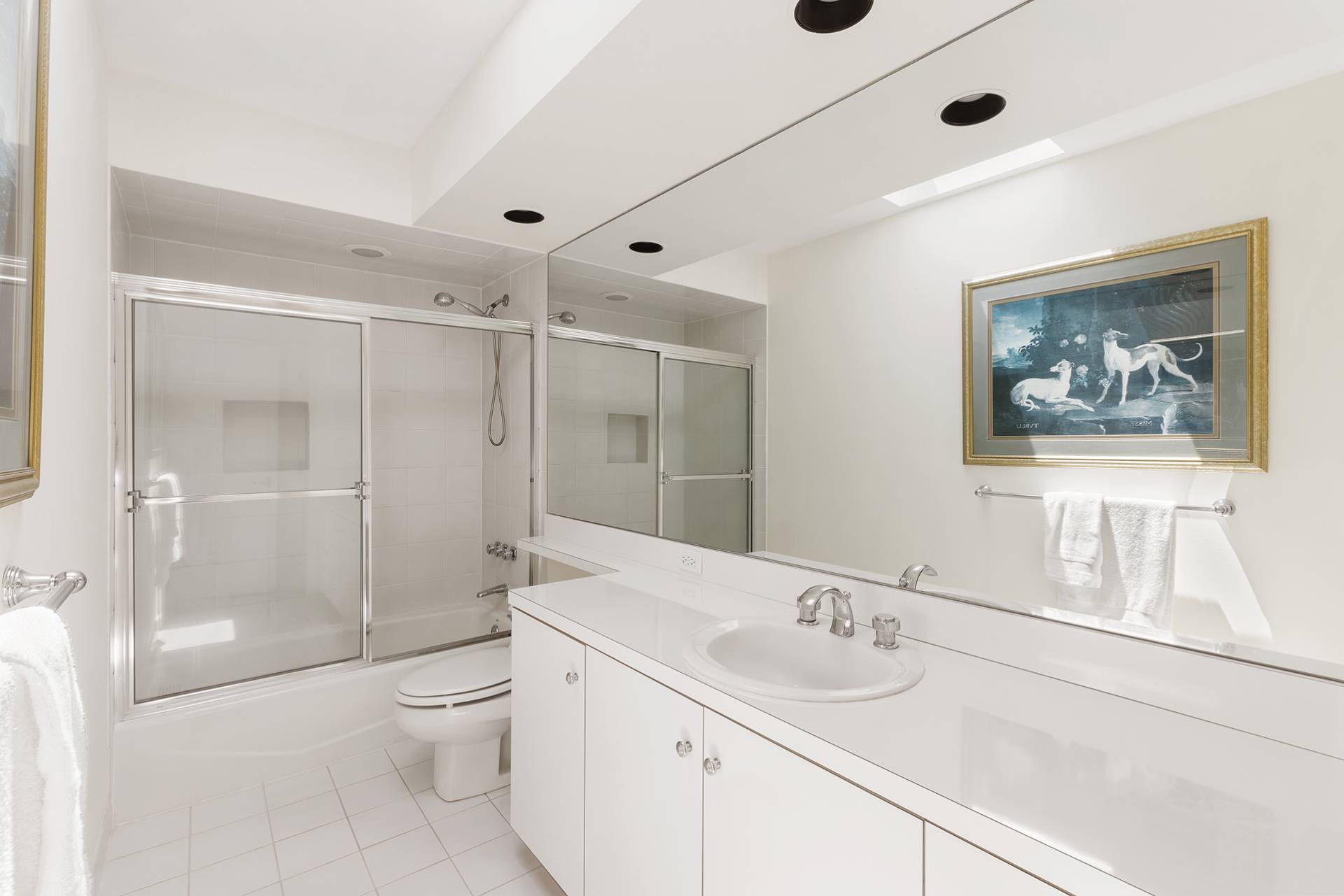 147 Old Northwest Road East Hampton, NY 11937 - Photo 17 of 33 a bathroom with a granite countertop sink a toilet a shower and a mirror