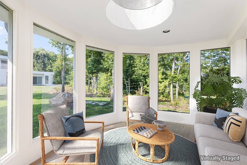 147 Old Northwest Road East Hampton, NY 11937 - Photo 26 of 33 a living room with furniture and a large window