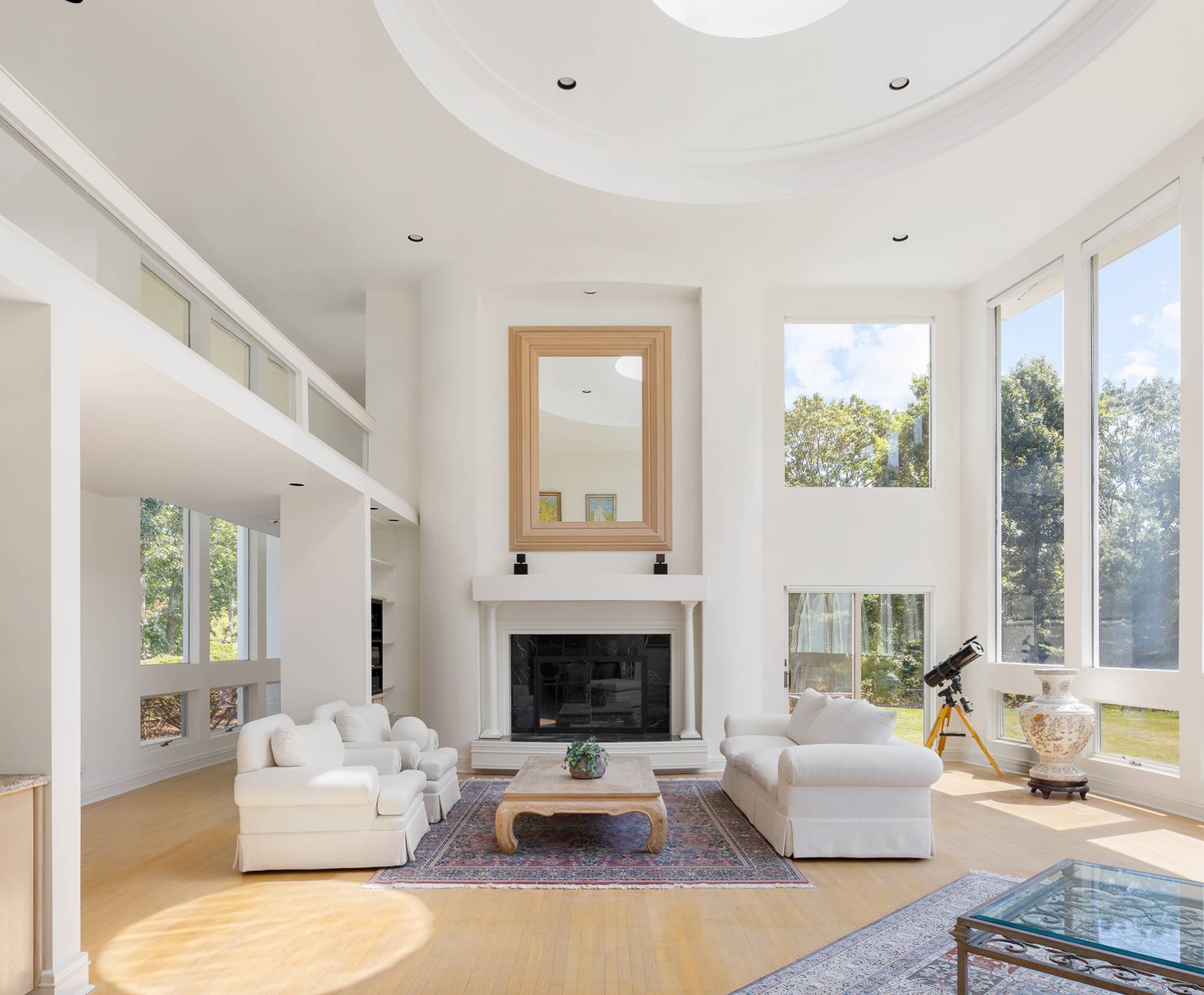 147 Old Northwest Road East Hampton, NY 11937 - Photo 4 of 33 a living room with furniture large window and a fireplace