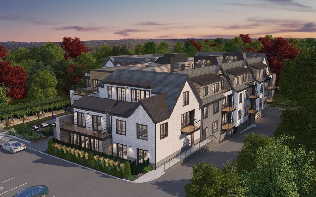 148 Weston Road, Unit 102 Wellesley, MA 02482 - Photo 2 of 32 an aerial view of multiple houses with a yard
