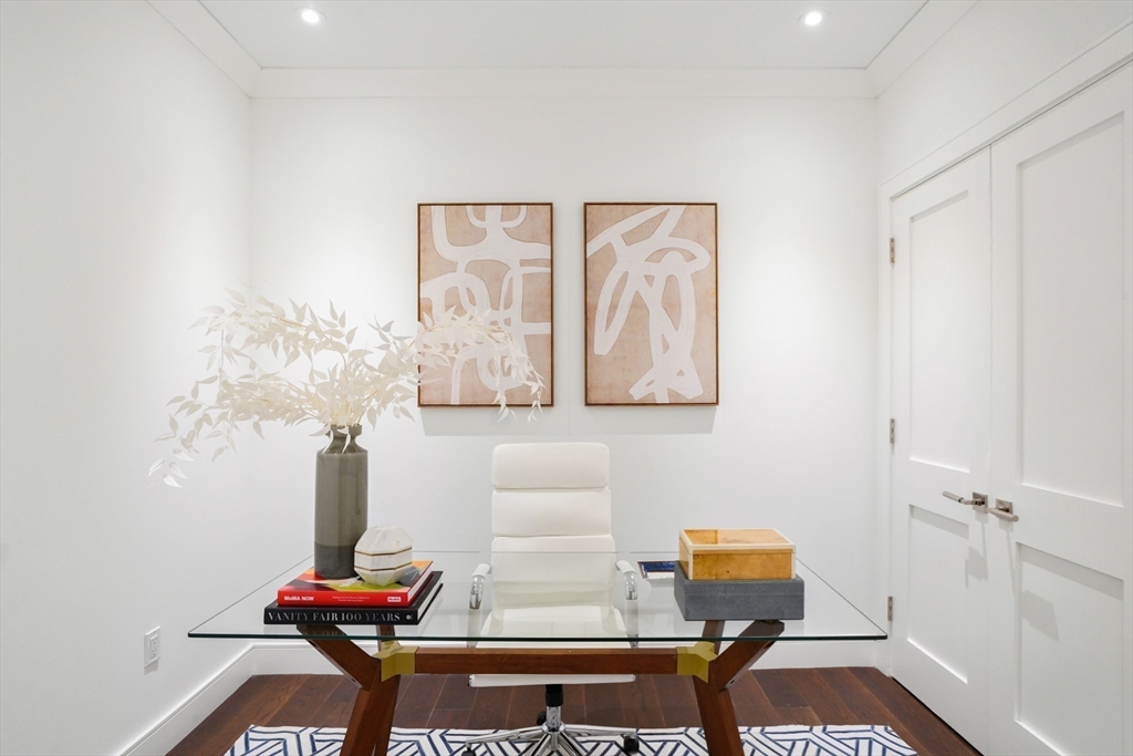 148 Weston Road, Unit 102 Wellesley, MA 02482 - Photo 21 of 32 a room with furniture and wooden floor
