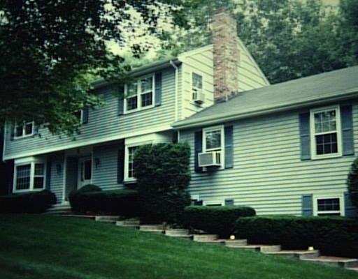 8 Brookbend Road Trumbull, CT 06611 - Photo 1 of 1 a front view of a house with a garden