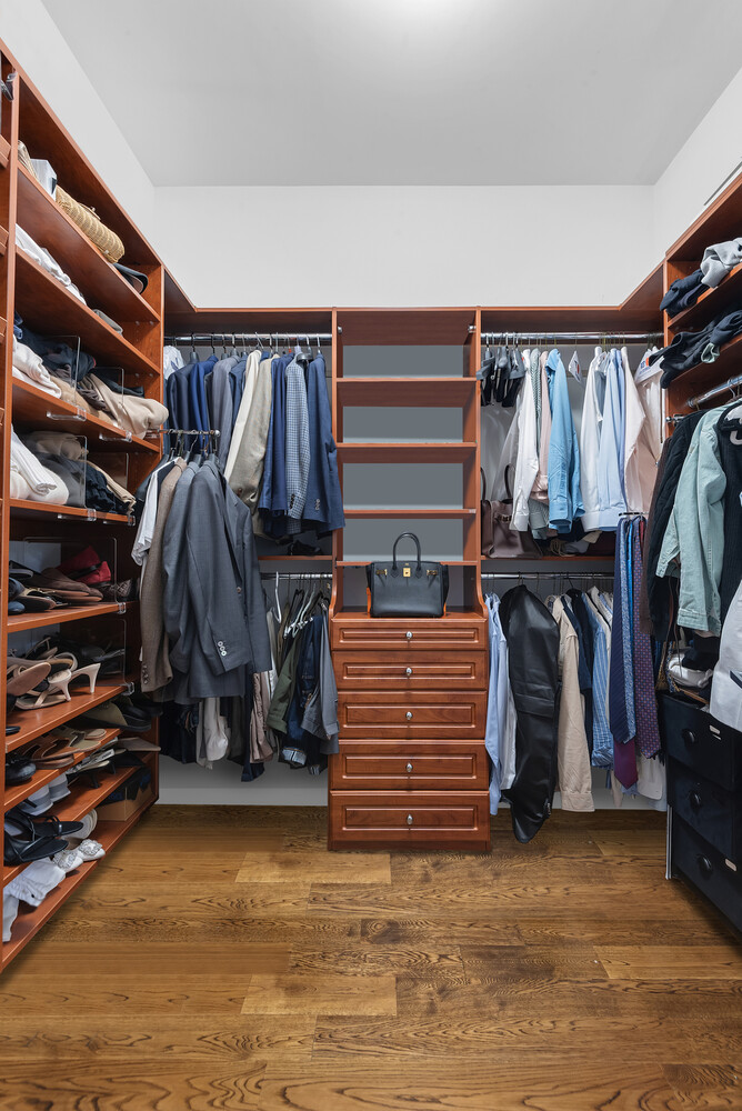 260 Park Avenue South, Unit 2E Manhattan, NY 10010 - Photo 10 of 20 a view of walk in closet with clothes and shoes