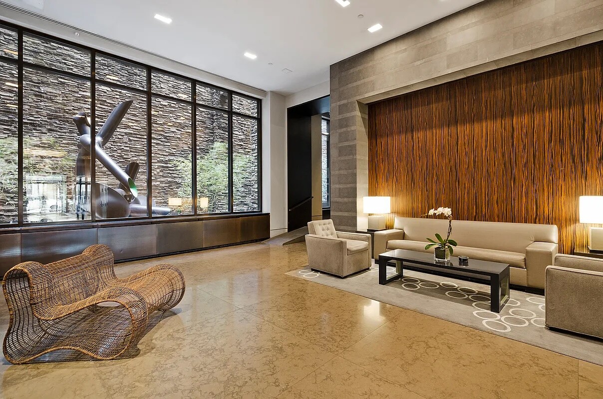 260 Park Avenue South, Unit 2E Manhattan, NY 10010 - Photo 16 of 20 a living room with furniture and large windows