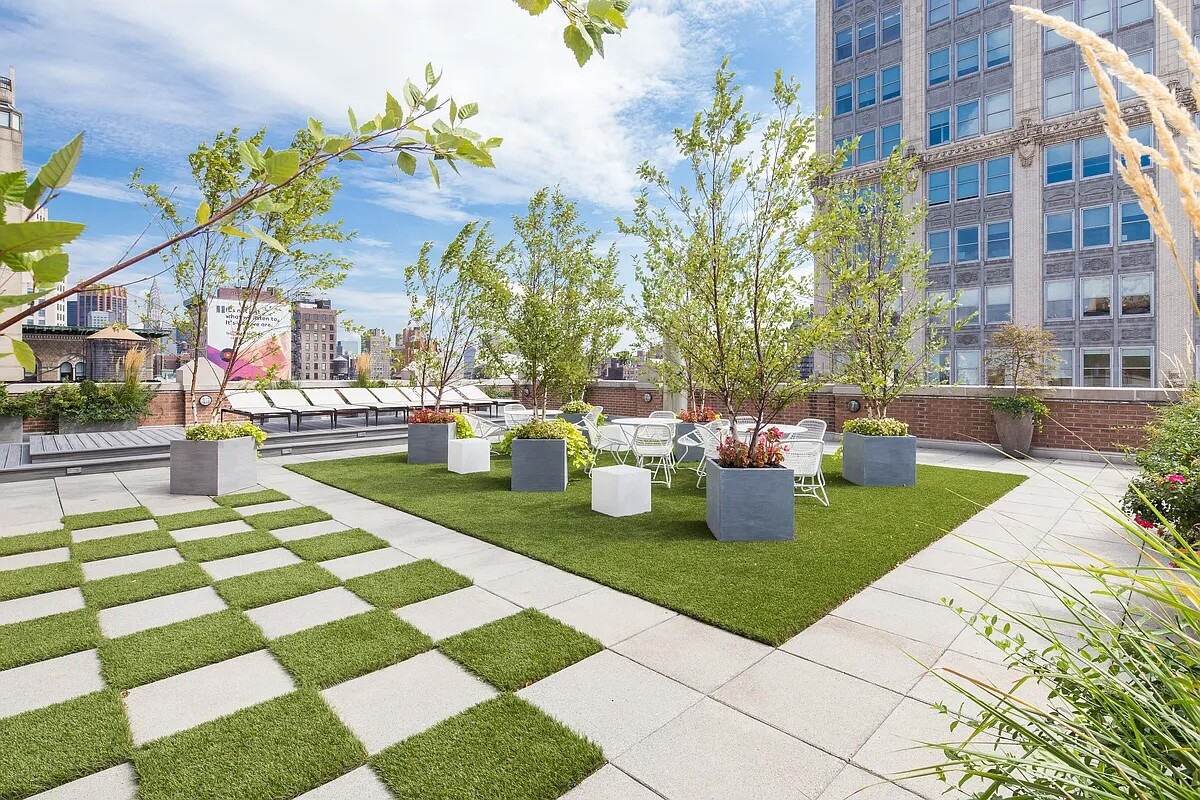 260 Park Avenue South, Unit 2E Manhattan, NY 10010 - Photo 17 of 20 a view of a patio with couches and table and chairs and potted plants