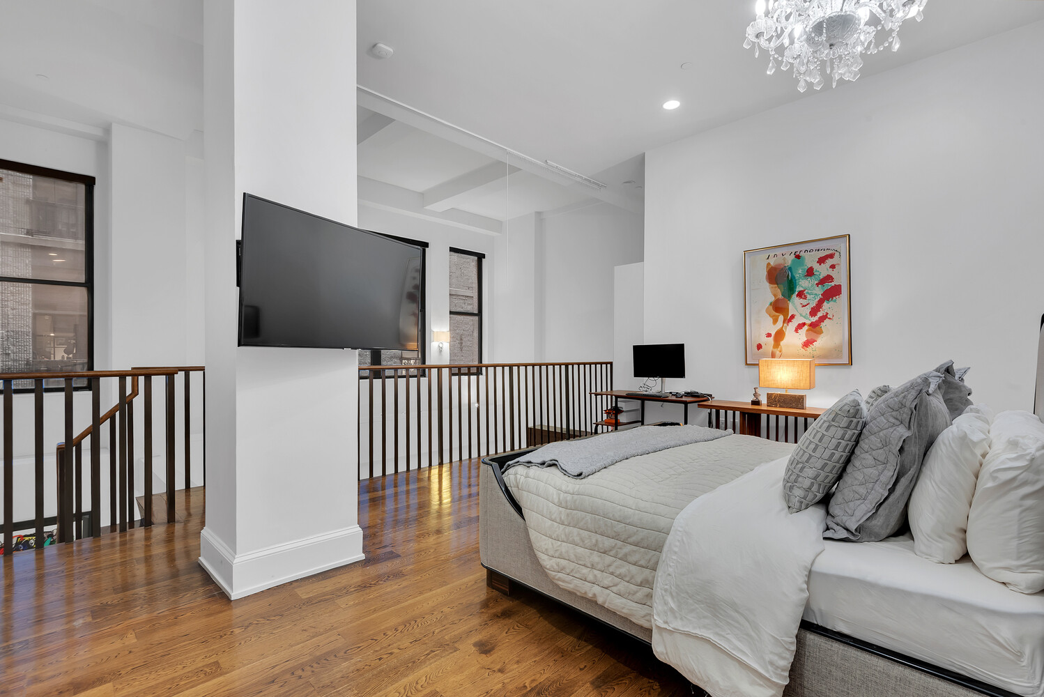 260 Park Avenue South, Unit 2E Manhattan, NY 10010 - Photo 4 of 20 a bedroom with a bed and a flat screen tv