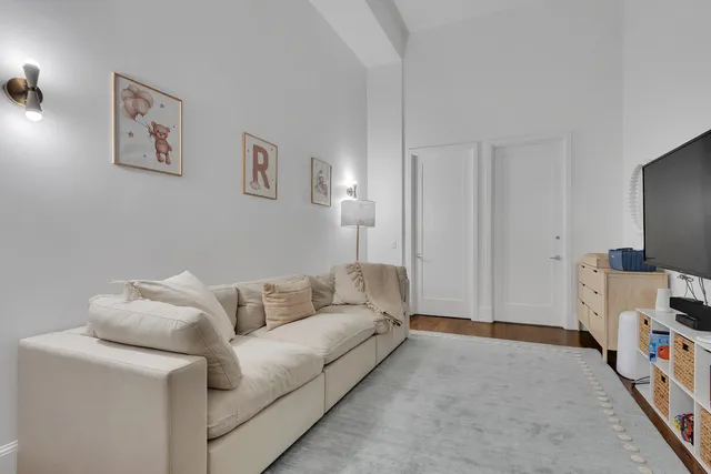 a kitchen with a refrigerator a sink and cabinets