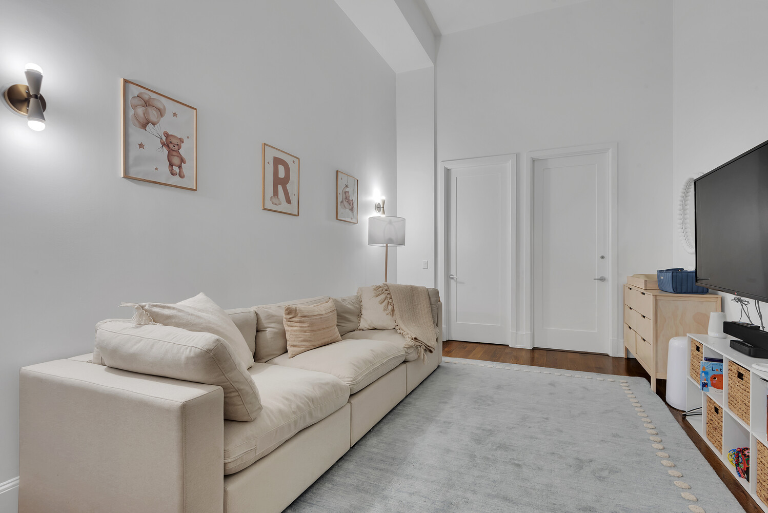 260 Park Avenue South, Unit 2E Manhattan, NY 10010 - Photo 8 of 20 a living room with furniture and a flat screen tv