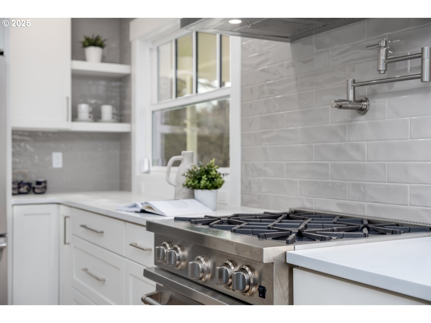 8889 Southwest Becker Drive Portland, OR 97223 - Photo 14 of 32 a stove top oven sitting inside of a kitchen