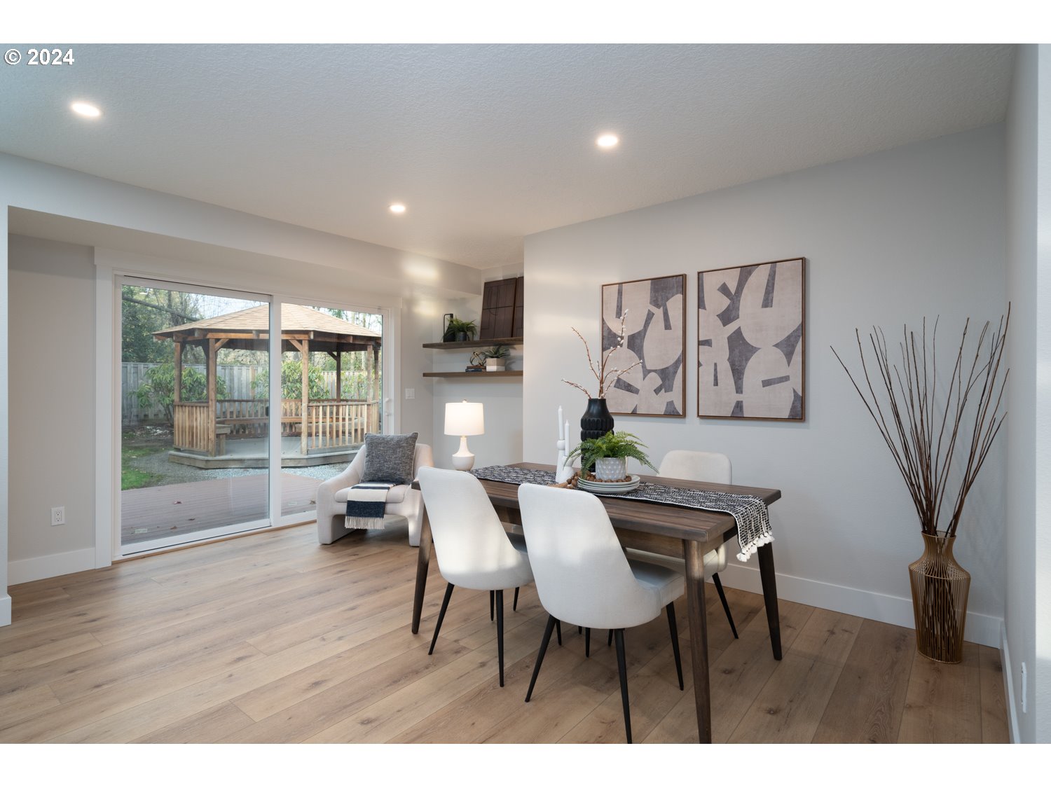 8889 Southwest Becker Drive Portland, OR 97223 - Photo 16 of 32 a dining room with furniture and wooden floor