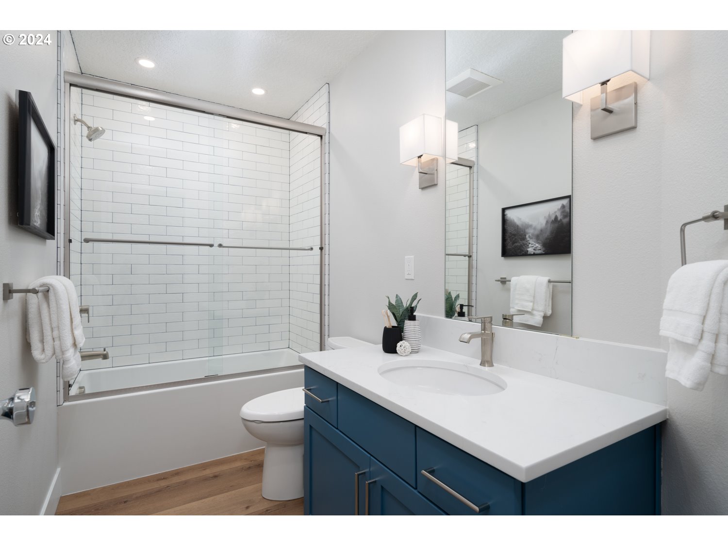 8889 Southwest Becker Drive Portland, OR 97223 - Photo 25 of 32 a bathroom with a sink a toilet a mirror and shower