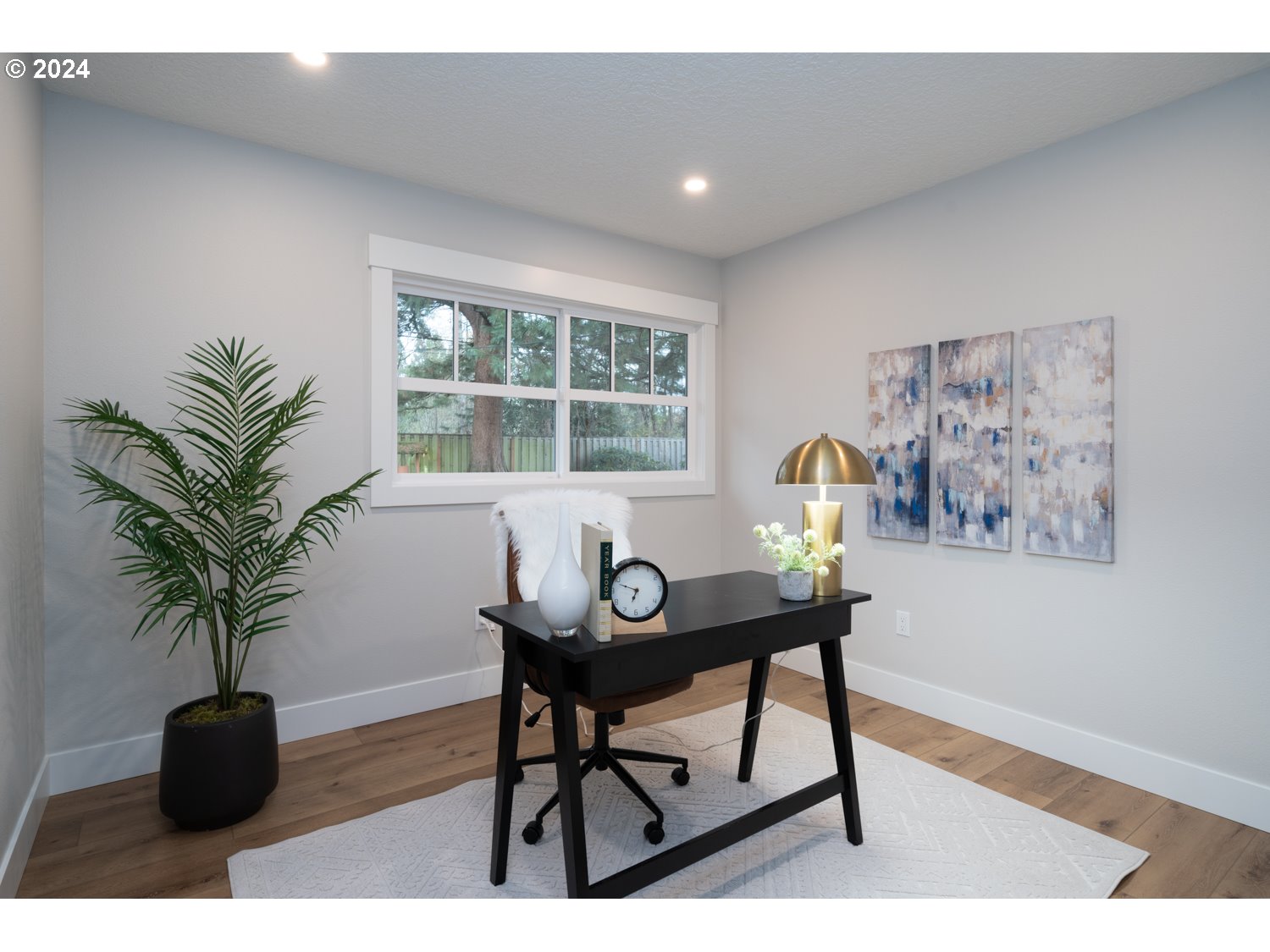 8889 Southwest Becker Drive Portland, OR 97223 - Photo 26 of 32 a workspace with furniture and a potted plant