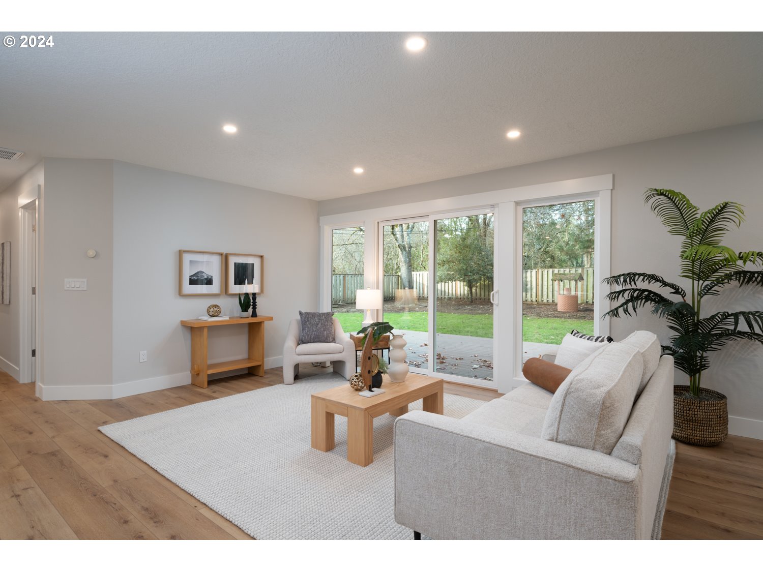 8889 Southwest Becker Drive Portland, OR 97223 - Photo 5 of 32 a living room with furniture large window and wooden floor