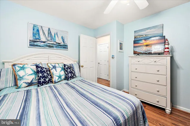 a bedroom with a bed and a dresser