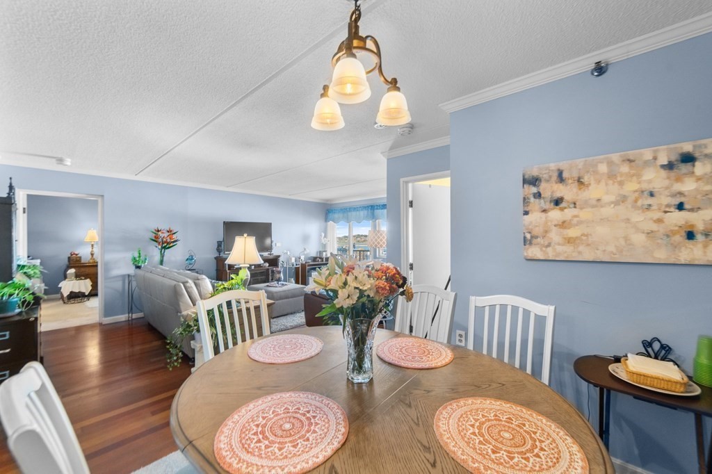 100 Cove Way, Unit 608 Quincy, MA 02169 - Photo 12 of 26 a view of a dining room with furniture