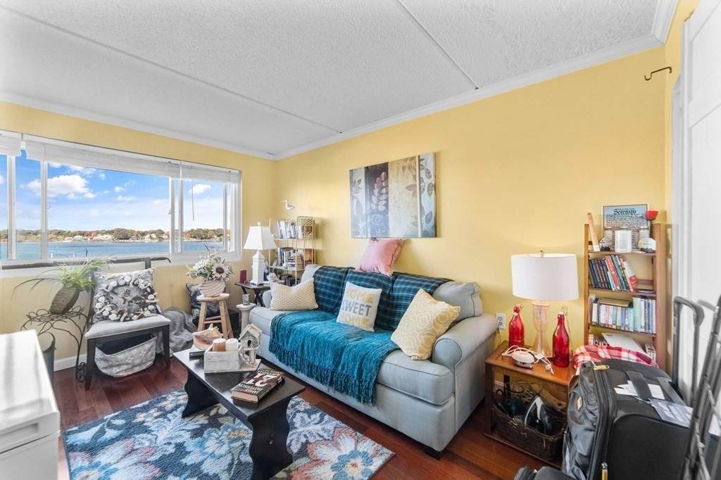 100 Cove Way, Unit 608 Quincy, MA 02169 - Photo 14 of 26 a living room with furniture and a large window