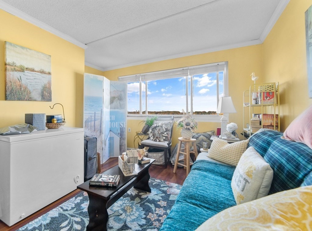 100 Cove Way, Unit 608 Quincy, MA 02169 - Photo 15 of 26 a living room with furniture and a table