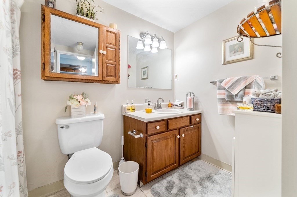 100 Cove Way, Unit 608 Quincy, MA 02169 - Photo 19 of 26 a spacious bathroom with a toilet sink and mirror