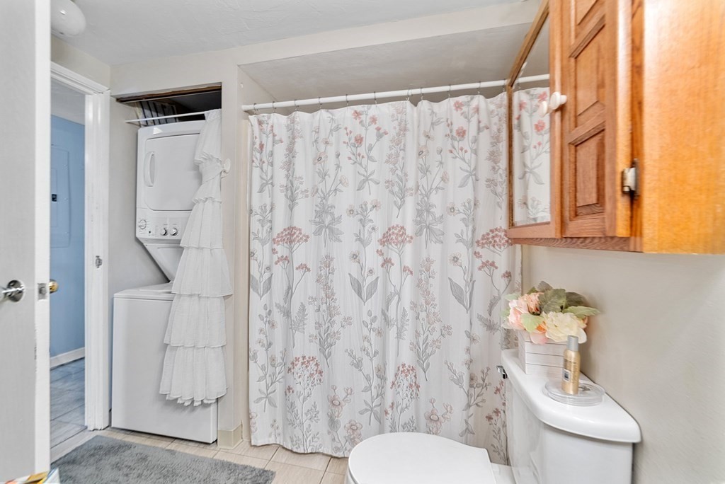 100 Cove Way, Unit 608 Quincy, MA 02169 - Photo 20 of 26 a white toilet sitting next to a bathroom sink