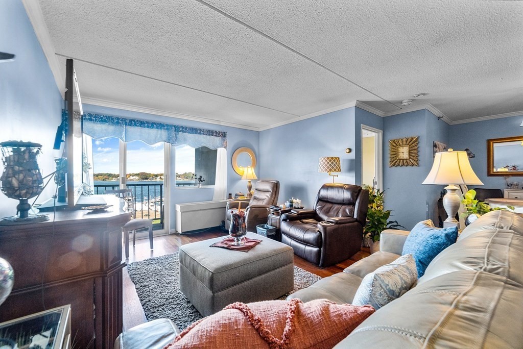 100 Cove Way, Unit 608 Quincy, MA 02169 - Photo 8 of 26 a living room with furniture and a large window