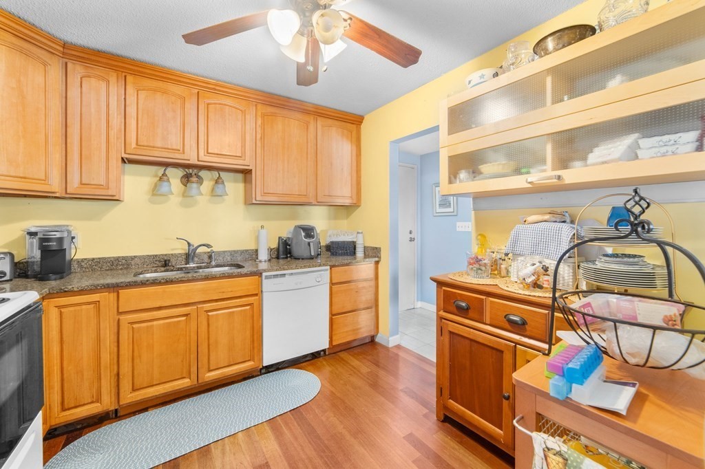 100 Cove Way, Unit 608 Quincy, MA 02169 - Photo 10 of 26 a kitchen with stainless steel appliances granite countertop a sink and cabinets