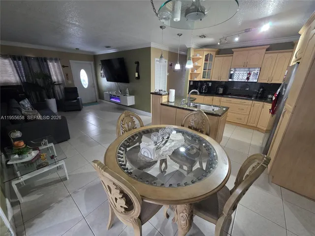 a kitchen with a sink a stove and cabinets