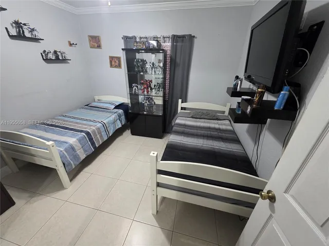 a bedroom with a bed and a walk in closet