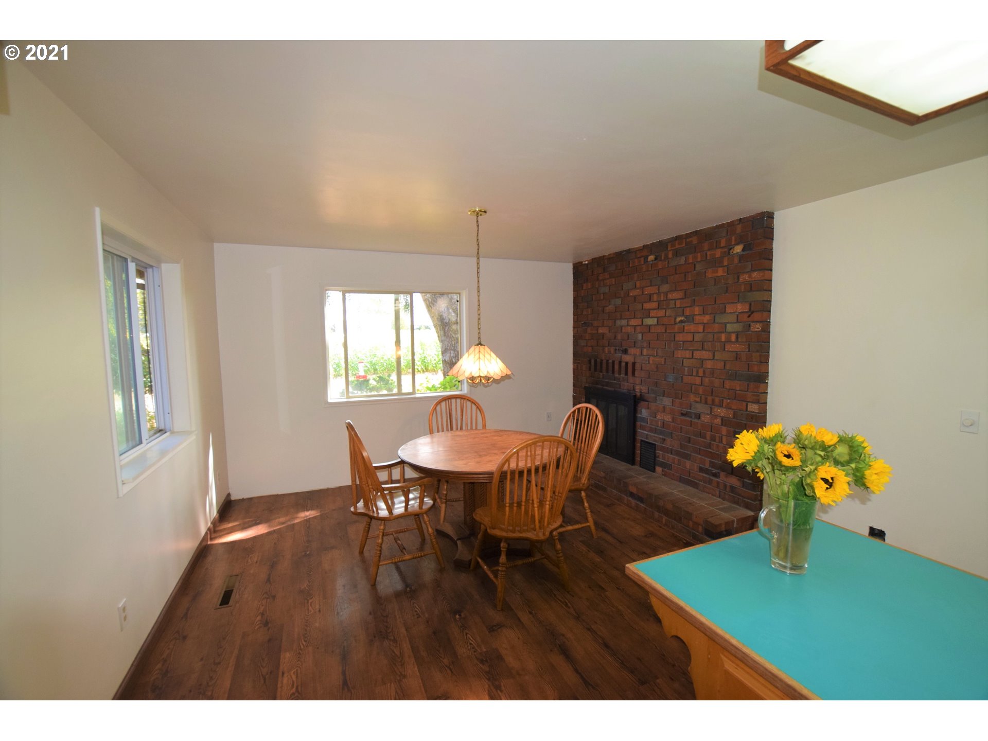 10107 South Kraxberger Road Canby, OR 97013 - Photo 8 of 32 a view of a dining room with furniture and a window