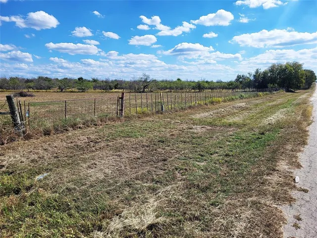 a view of a lake with houses in the back