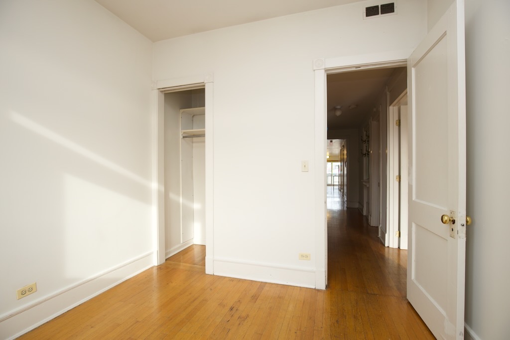 6717 North Sheridan Road, Unit 3S Chicago, IL 60626 - Photo 13 of 20 an empty room with wooden floor and closet
