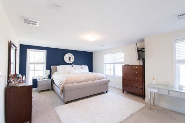 91 Bronson Street Fall River, MA 02721 - Photo 3 of 30 a bedroom with a bed and a dresser