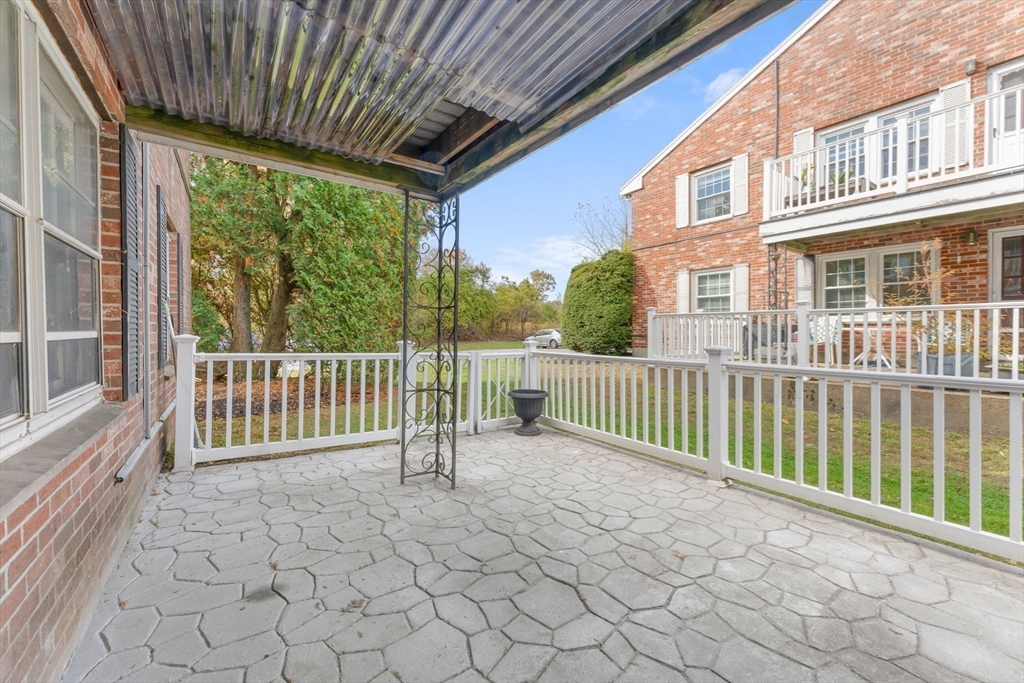 5 Elm Street, Unit 1 Acton, MA 01720 - Photo 5 of 30 a view of a porch with a backyard