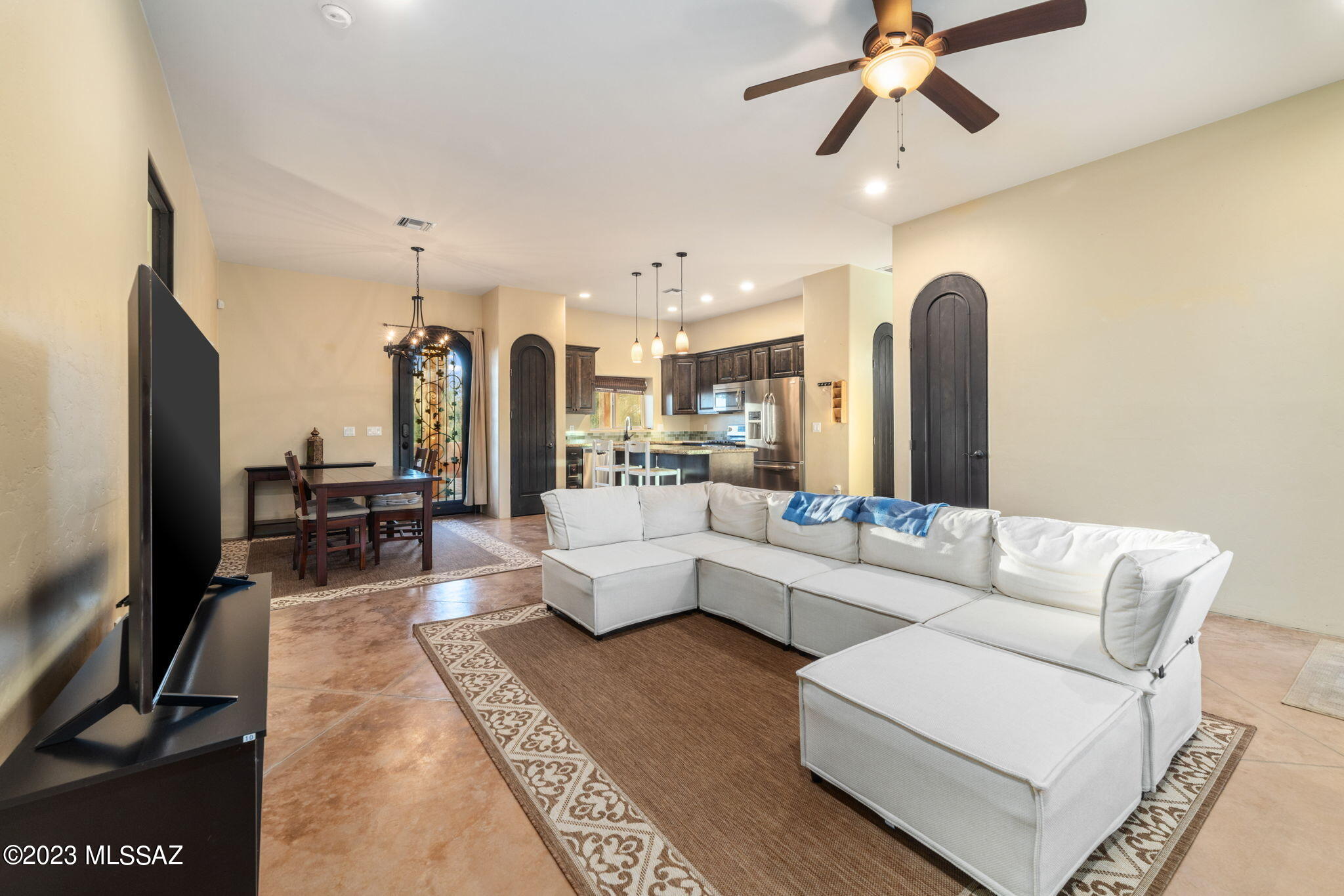 5670 Triangle X Place Tucson, AZ 85713 - Photo 20 of 36 a living room with furniture and a flat screen tv