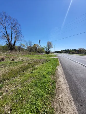 a view of a road with an ocean view