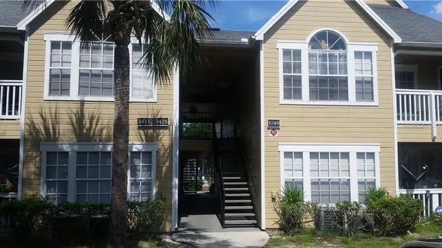 a view of a brick building next to a yard