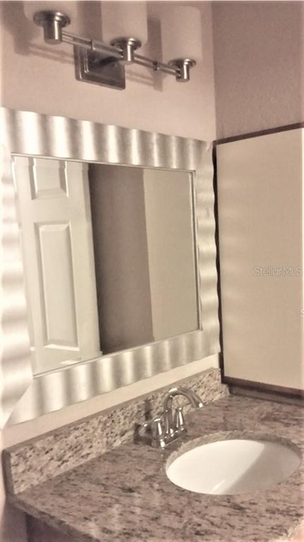 1049 South Hiawassee Road, Unit 3416 Orlando, FL 32835 - Photo 11 of 22 a view of a bathroom with a sink