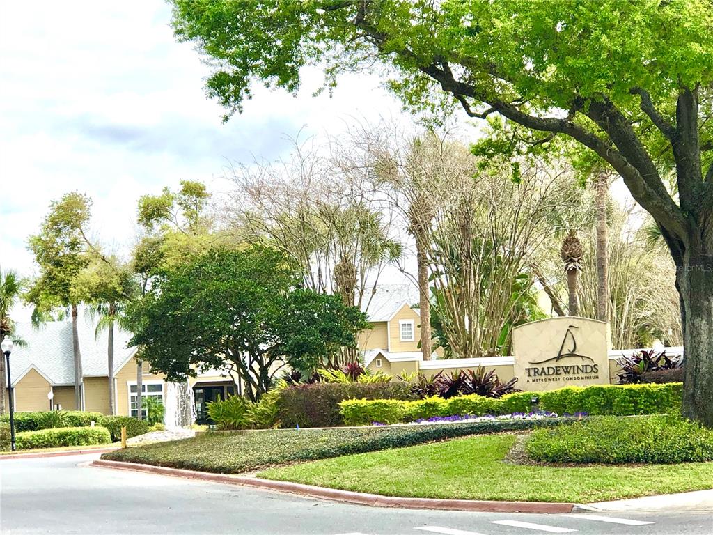 1049 South Hiawassee Road, Unit 3416 Orlando, FL 32835 - Photo 15 of 22 a view of a white house with a yard and plants