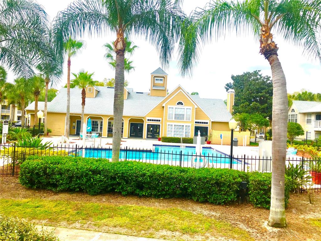 1049 South Hiawassee Road, Unit 3416 Orlando, FL 32835 - Photo 21 of 22 a front view of house with yard and green space