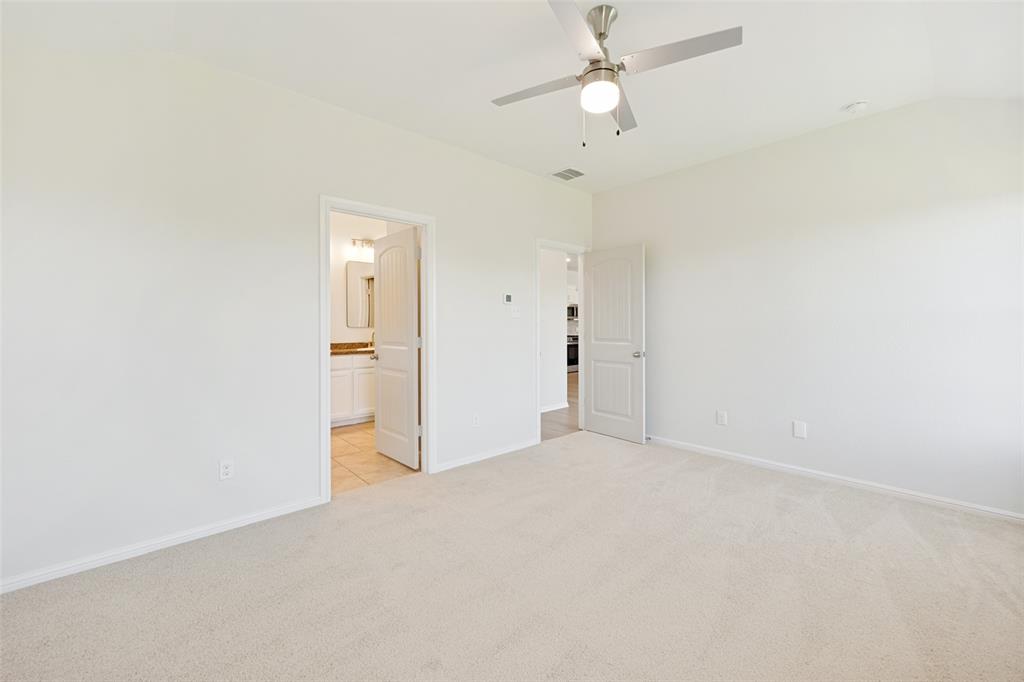 857 Watson Way Crowley, TX 76036 - Photo 9 of 25 Carpeted interior room featuring a contemporary ceiling fan with light, white walls, and white trim