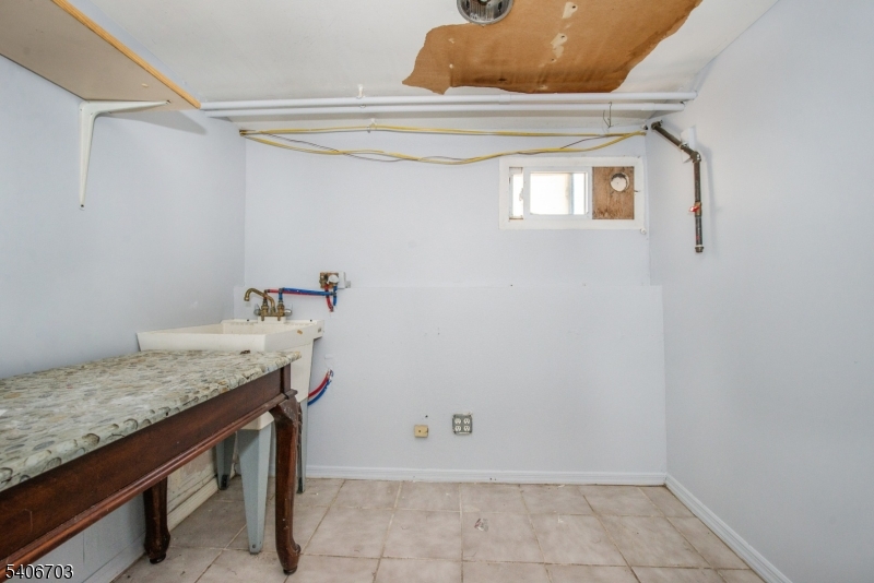 86 Watsessing Avenue, Unit 1 Bloomfield, NJ 07003 - Photo 18 of 21 a bathroom with a sink and a window