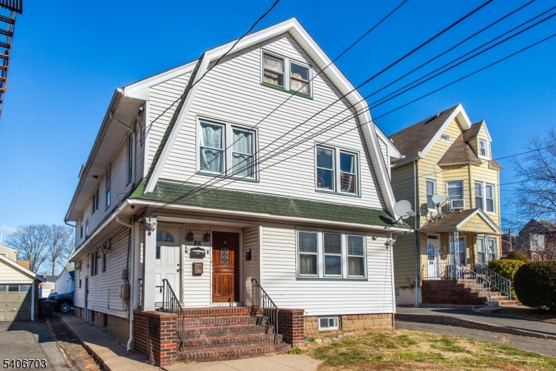 86 Watsessing Avenue, Unit 1 Bloomfield, NJ 07003 - Photo 2 of 21 a view of a white building among the street