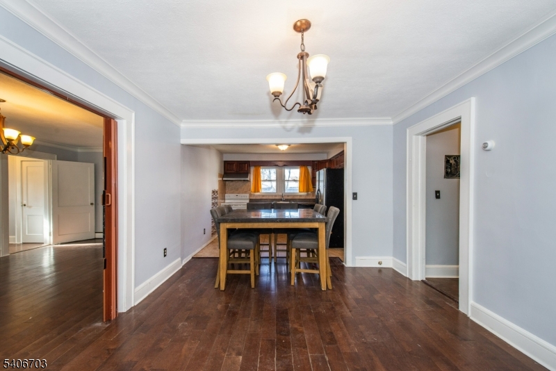 86 Watsessing Avenue, Unit 1 Bloomfield, NJ 07003 - Photo 5 of 21 a view of a dining room with furniture wooden floor and chandelier
